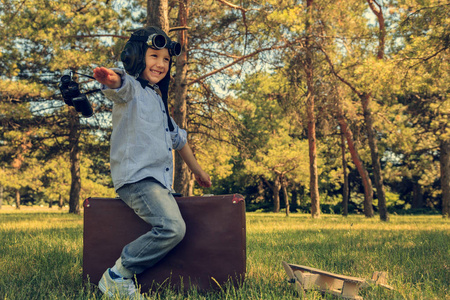  Happy child In a helmet with glasses and binoculars, playing wi