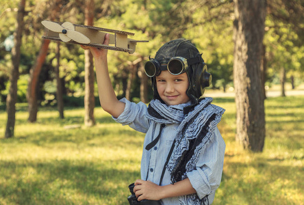  Happy child In a helmet with glasses and binoculars, playing wi