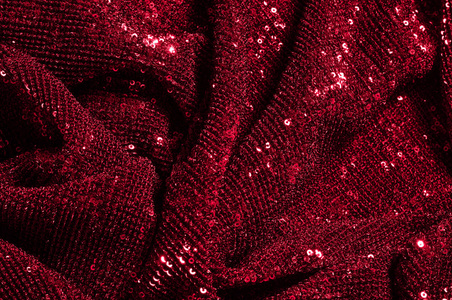 纹理背景图案红色织物与桶。 看看这些霓虹灯红色亮片。 圆形的霓虹灯，粉红色的火花，重叠的彩虹闪光在一个干净的紫色网格上。