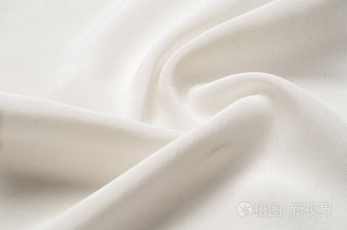 纹理背景图案. 白色丝绸织物. 一种波纹白色丝绸织物的特写. 广告位.