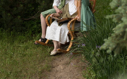 s story. grandmother with her grandchildren sitting in a rocking