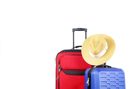  blue hard shell luggage with straw hat hanging on extended tele