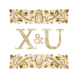 x和u首字母复古标志。 被装饰性元素包围的字母。 皇家风格的婚礼或商业伙伴字母。