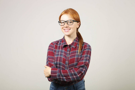  black frame eyeglasses standing in confident pose with folded h