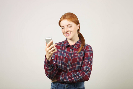  chatting. Female college student using mobile app on smartphone