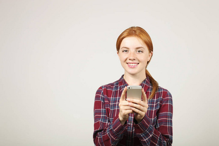  chatting. Female college student using mobile app on smartphone