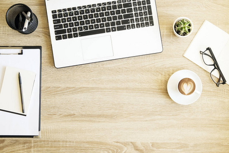  white laptop computer keyboard, cup of coffee with heart shape 