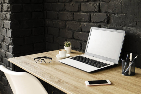  folded eye glasses on wooden table in loft style  with bl