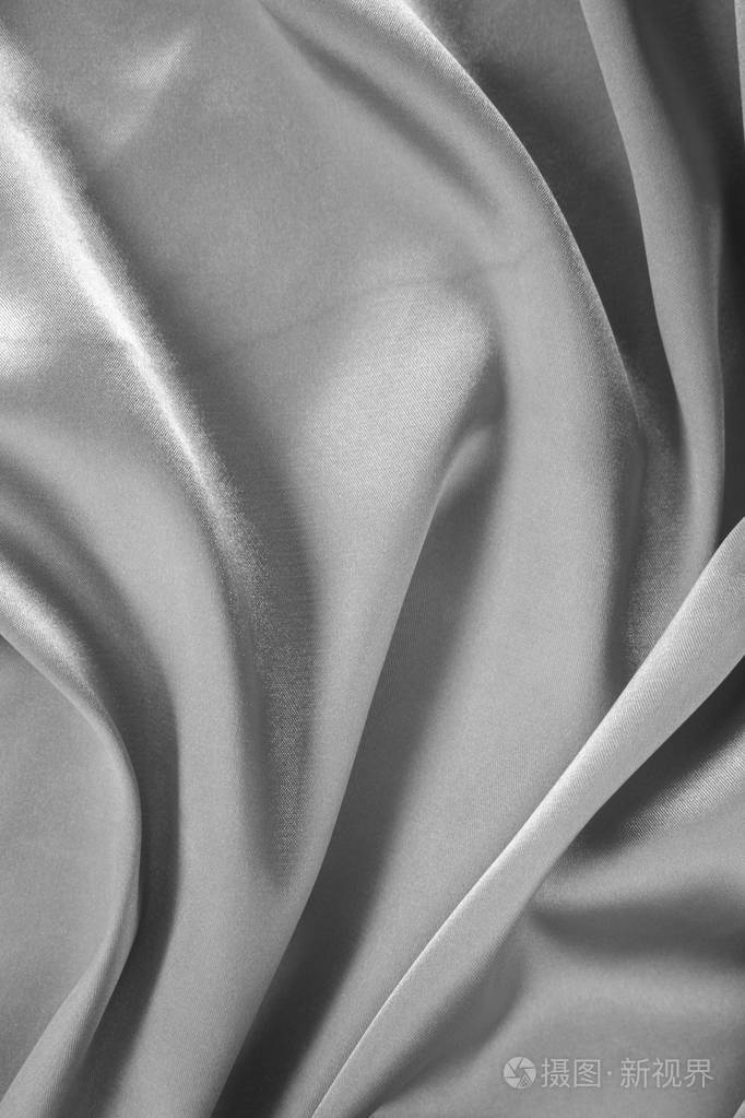 光滑优雅的灰色丝绸或缎纹纹理用于背景.