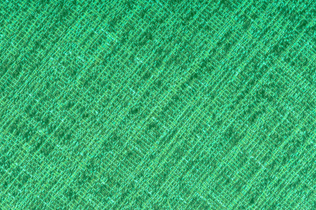绿色织物纹理背景。 抽象背景空模板。