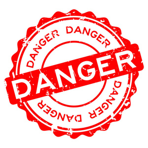 红色危险字白色背景上的圆形橡胶印章照片