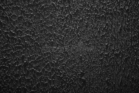 绑石膏粗糙的纹理,粗糙粗糙的深色背景,黑色的石膏灰泥墙照片