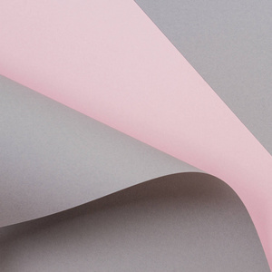 抽象几何形状灰色和粉红色的彩色纸背景。