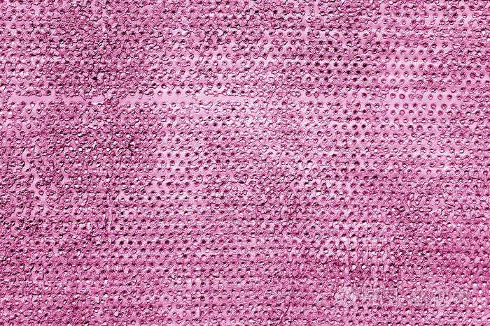 粗糙生锈的金属表面呈粉红色背景和纹理