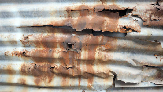 老锌生锈,锌腐烂,镀锌铁板生锈,金属腐蚀,五颜六色的背景.照片