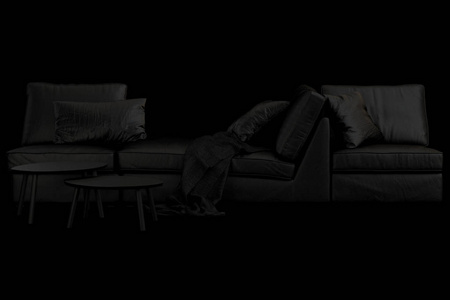 现代黑色家具，配有沙发地毯和黑色背景的咖啡桌。斯堪的纳维亚风格。现代风格。黑色织物装潢。3D渲染