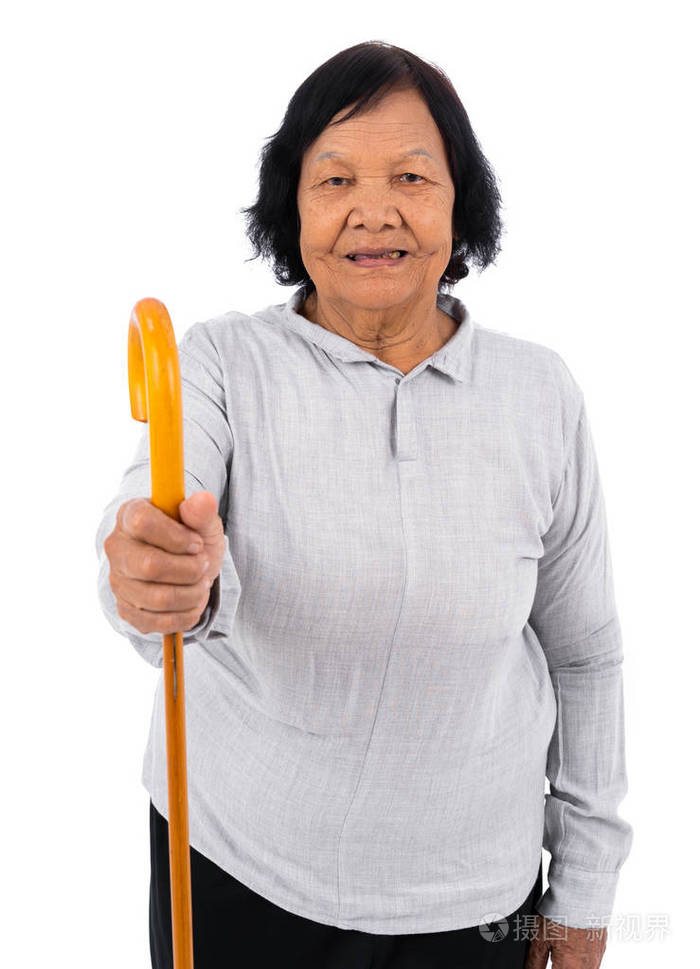 幸福的老年妇女,手里拿着一根拐杖,被隔离在白色背景上
