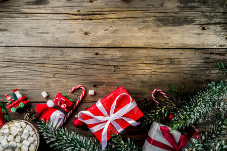 s new year toys, candy canes, pine cones, santa hat and gift box