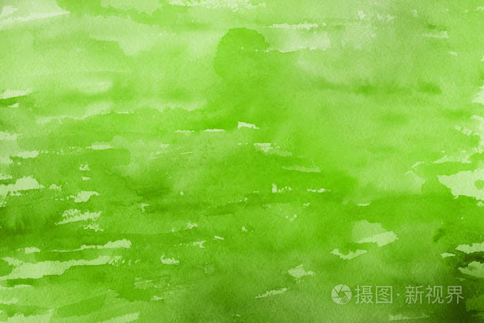 绿色水彩颜料在纸上抽象背景