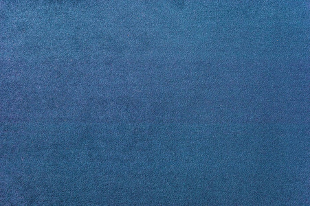 灰蓝色粗花呢质地特写深蓝色地毯的质地.渐变光的特写照片