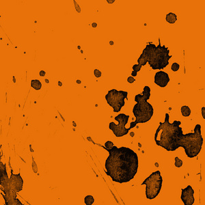 抽象的黑色油漆飞溅纹理在橙色背景上