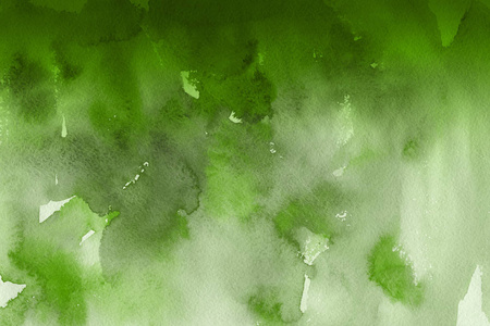 绿色水彩颜料在纸上抽象背景