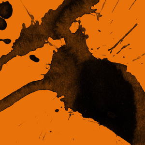 抽象的黑色油漆飞溅纹理在橙色背景上