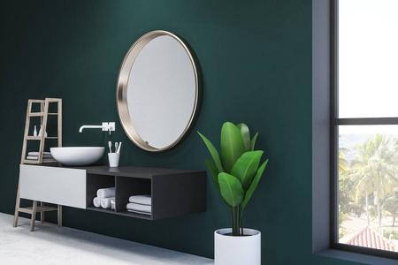 圆形白色水槽站在黑白虚荣心单元上，上面有一面圆形镜子。 带白色地板的翡翠浴室。 盆栽和架子。 3D渲染