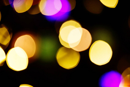 抽象的灯光庆祝背景与离焦的金色灯光为圣诞节新年假日派对