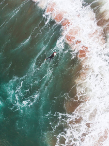 s Estoril coast, municipality of Cascais, with surfers surfing o