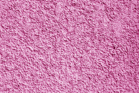 混凝土墙背景为粉红色。 抽象的建筑背景和设计纹理。