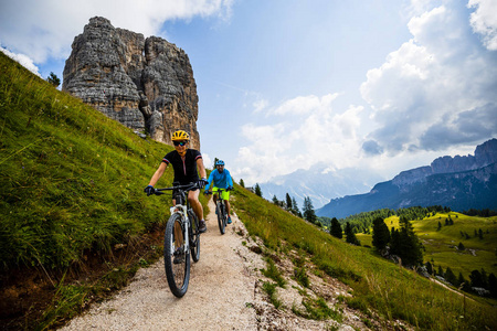 Ampezzo, stunning Cinque Torri and Tofana in background. Woman a