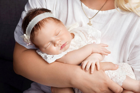 s hands. Closeup picture. Happy mother and her slipping smilibg 