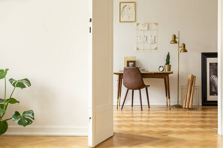 s workspace interior with a vintage, leather chair, kraft paper 