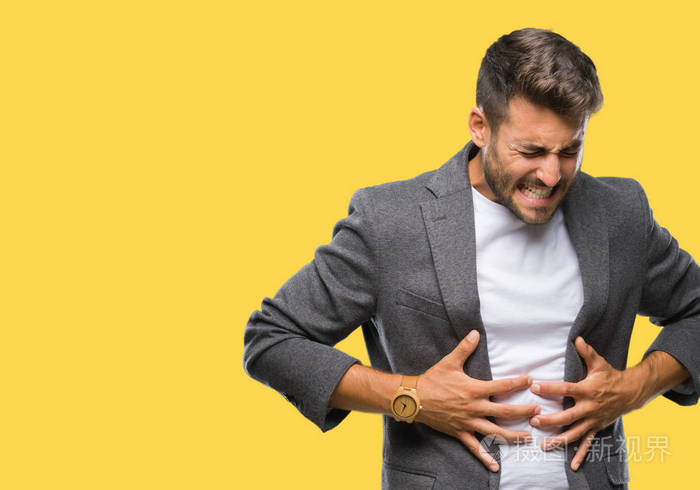 年轻英俊的商人由于消化不良痛苦的疾病感觉不舒服过了孤立的背景手