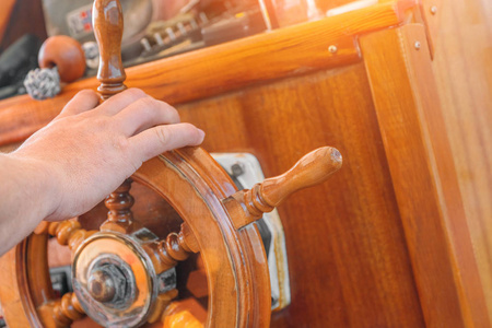 s hand holds a wooden ship39