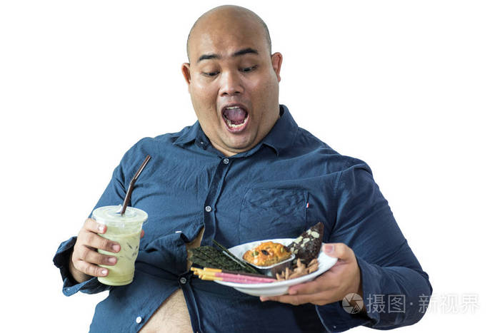 肥胖的人吃超重的人的肖像感到饥饿吃碎花片绿茶落在