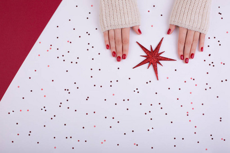 s hands on white and red background. Place for text. Flat lay st