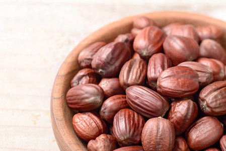 霍霍巴种子在桌子上霍霍巴油在玻璃瓶里霍霍巴矢量图