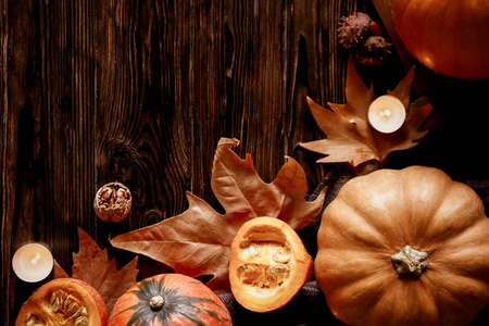  maple leaves and anise for decoration on wood textured table. C