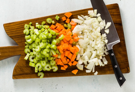 s knife on a wooden cutting board. Basic cutting for restaurants