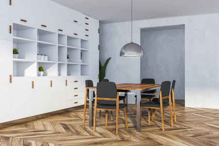 餐厅的角落，白色的墙壁，木制的地板，长桌，椅子和白色的橱柜。 3D渲染