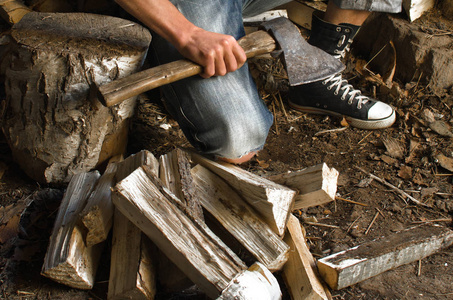 s hands and chopped wood