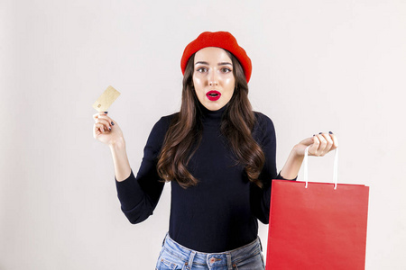  red beret, holding blank shopping bag. Autumn holiday sale seas