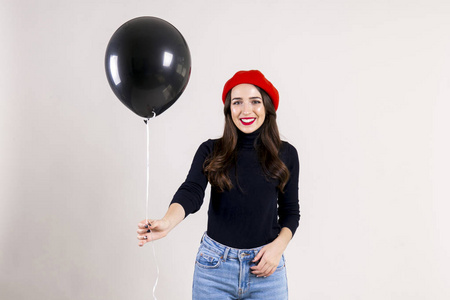  red beret, holding blank helium balloon. Holiday celebration co