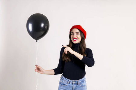  red beret, holding blank helium balloon. Holiday celebration co