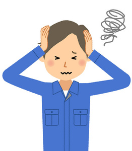 工作的年轻人抱头/这是一个男性工人抱头的例子.照片