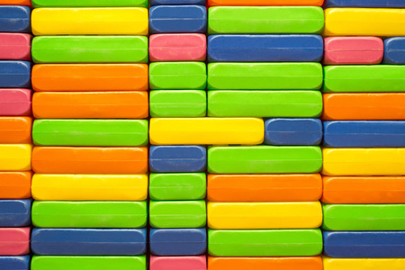 s constructor. Big pile plastic toy blocks. Background of bright