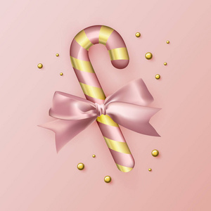 带蝴蝶结的圣诞糖果棒，粉红色背景