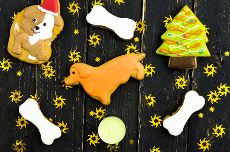 s yellow dog. Cookies with chocolate icing. Dark background with